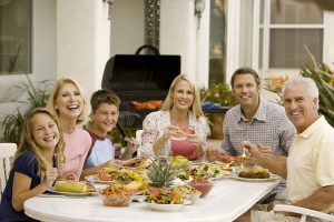 family enjoying a barbeque.